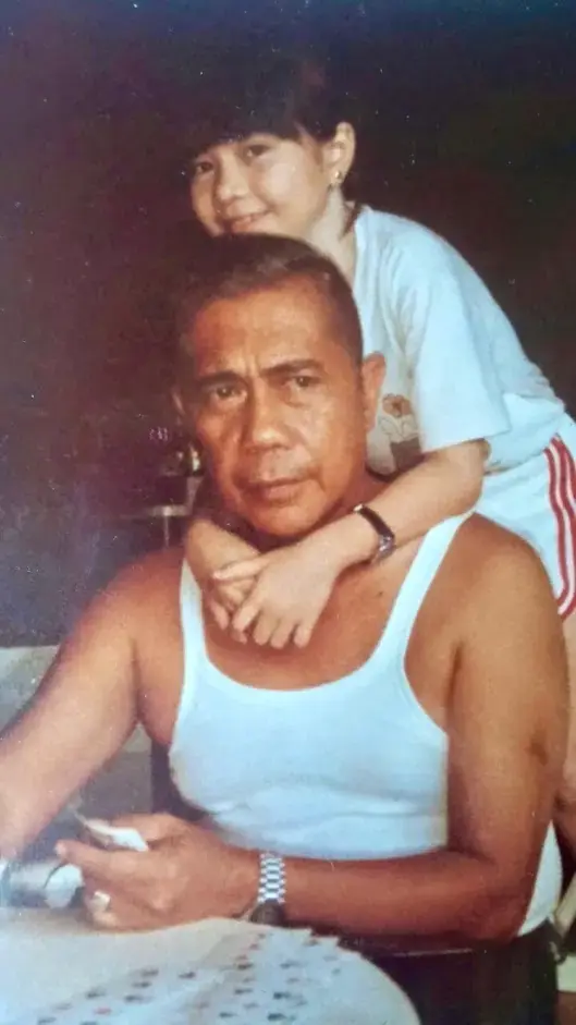A younger Marian Antona embracing her father